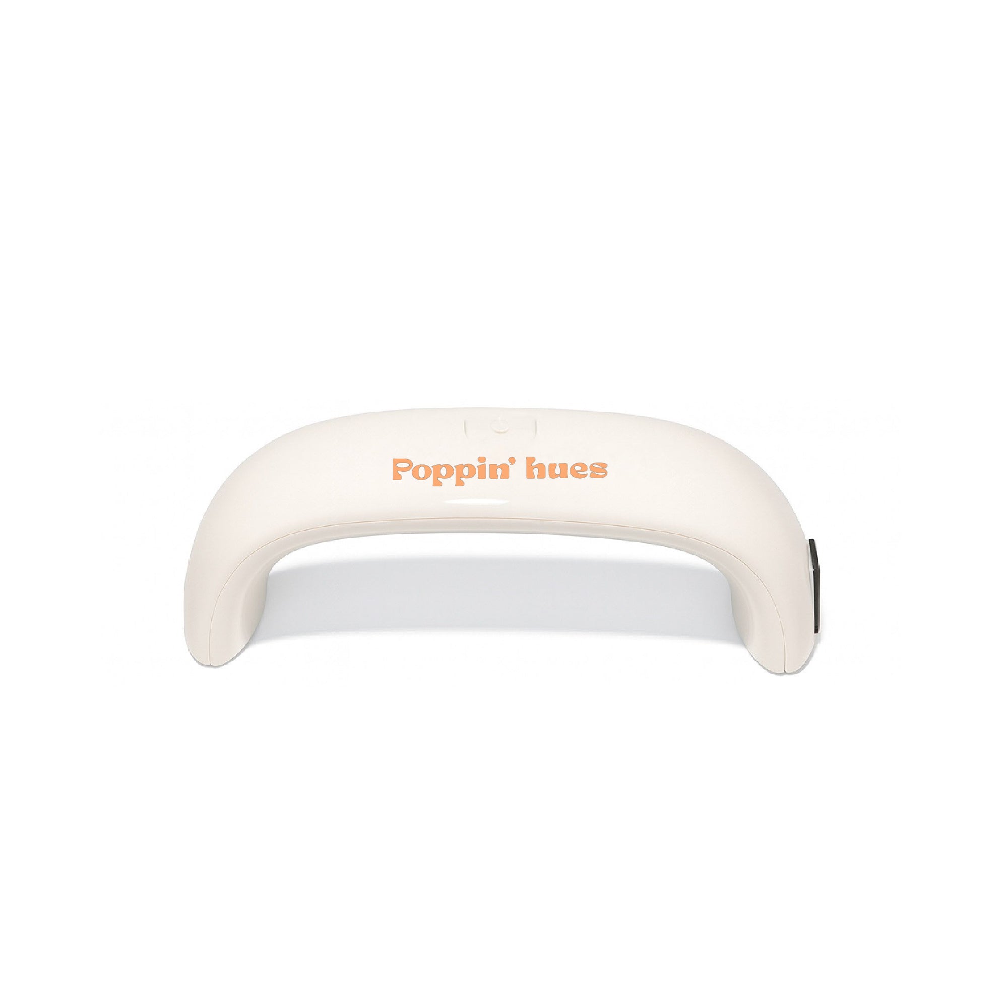 UV/LED nail lamp displayed on a white background, featuring a curved cream-colored design with the Poppin’ hues logo.