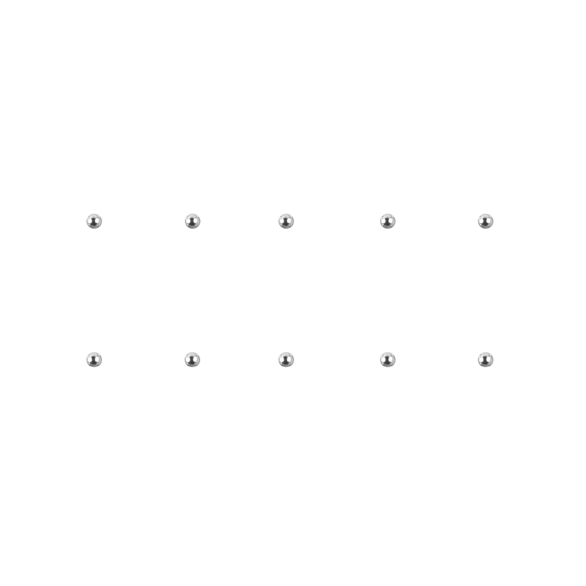 Set of silver chrome nail charms on a white background