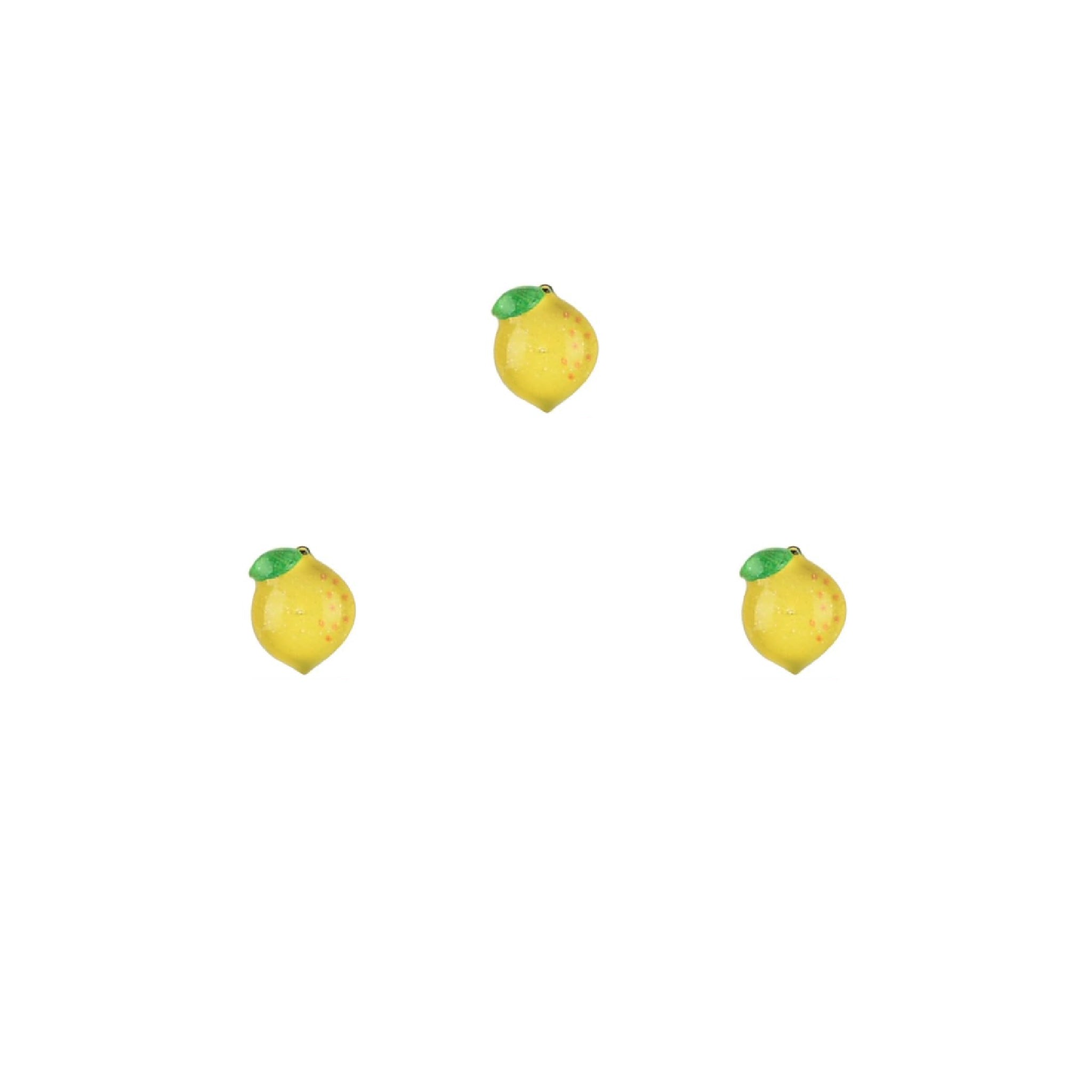 Three lemon-shaped nail charms on a white background