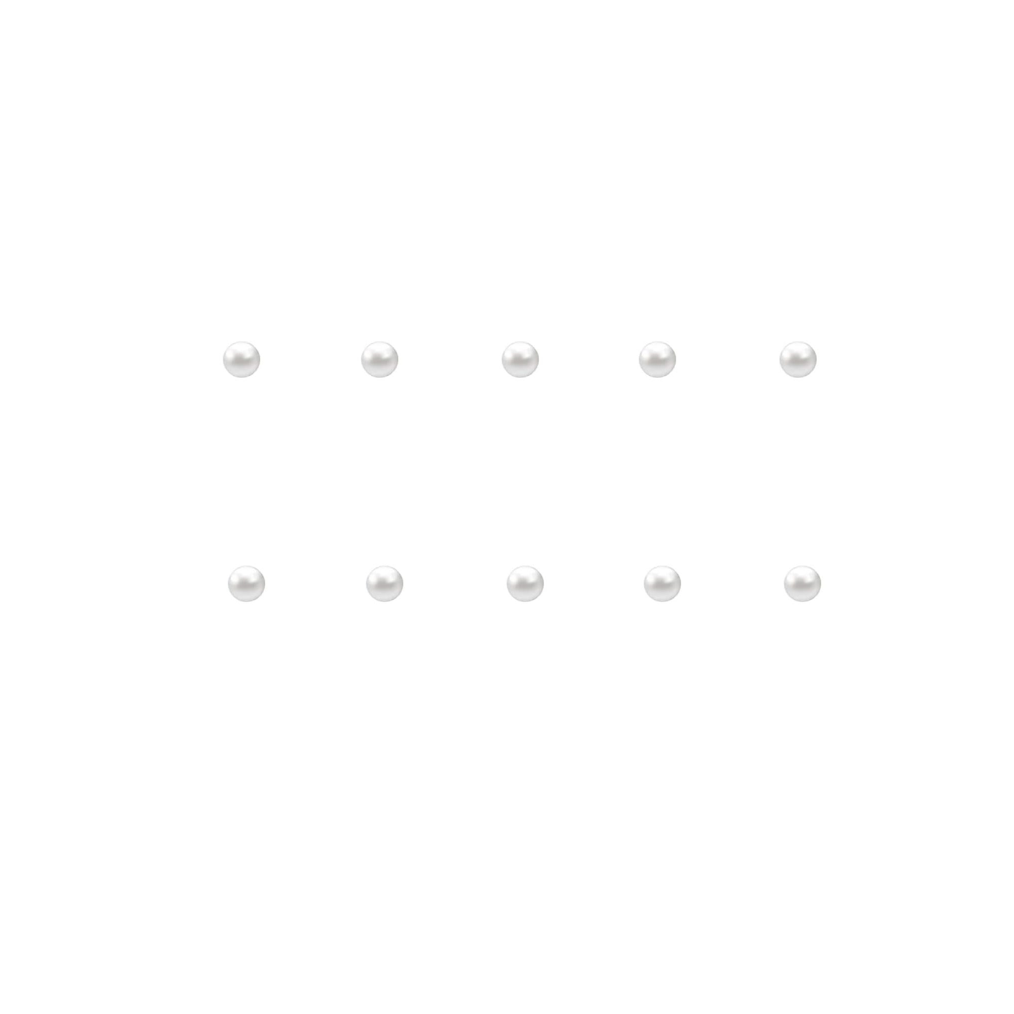 Set of small pearl nail charms on a white background