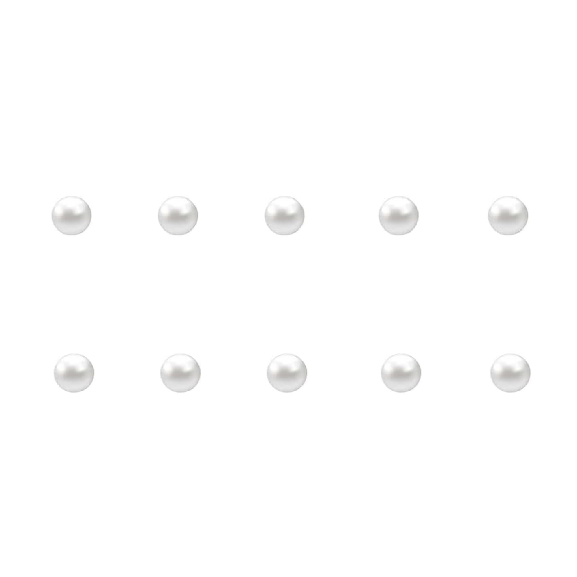 Set of small pearl nail charms on a white background